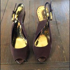 Brown suede sling back heels with a gold buckle